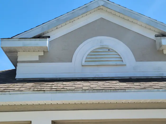 Before: Full exterior soft wash on a two-story home. Algae and mildew buildup gone.