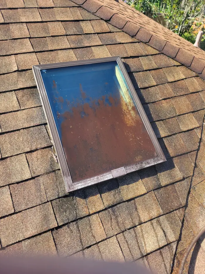 Before: Skylight on a shingle roof. Grime and oxidation removed without high pressure.