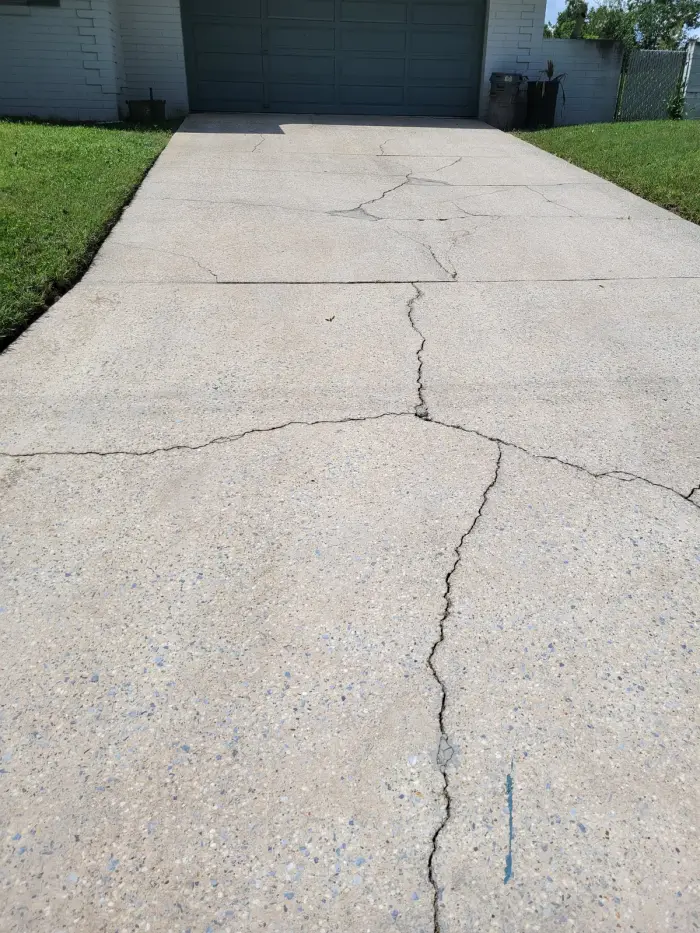 After: Three years of ground-in dirt and tire marks stripped off a two-car driveway.